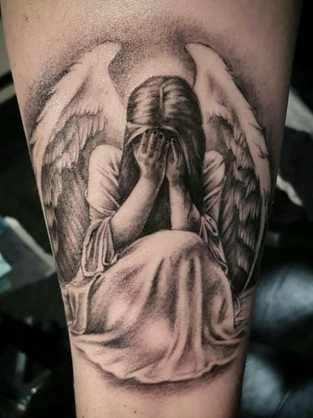 Tatuaje de ángel llorando