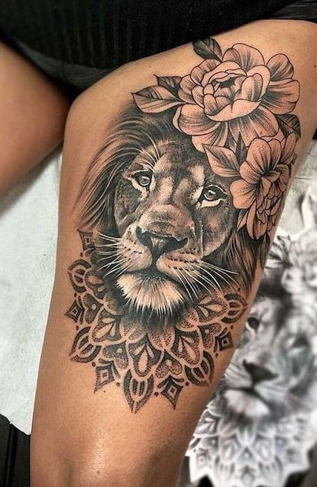 Tatuajes de león en el muslo 